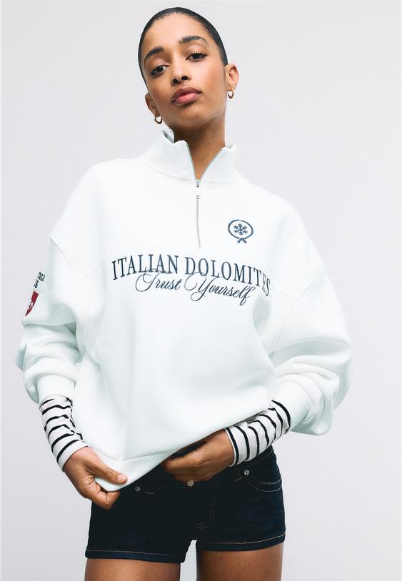 felpa con cerniera e ricami