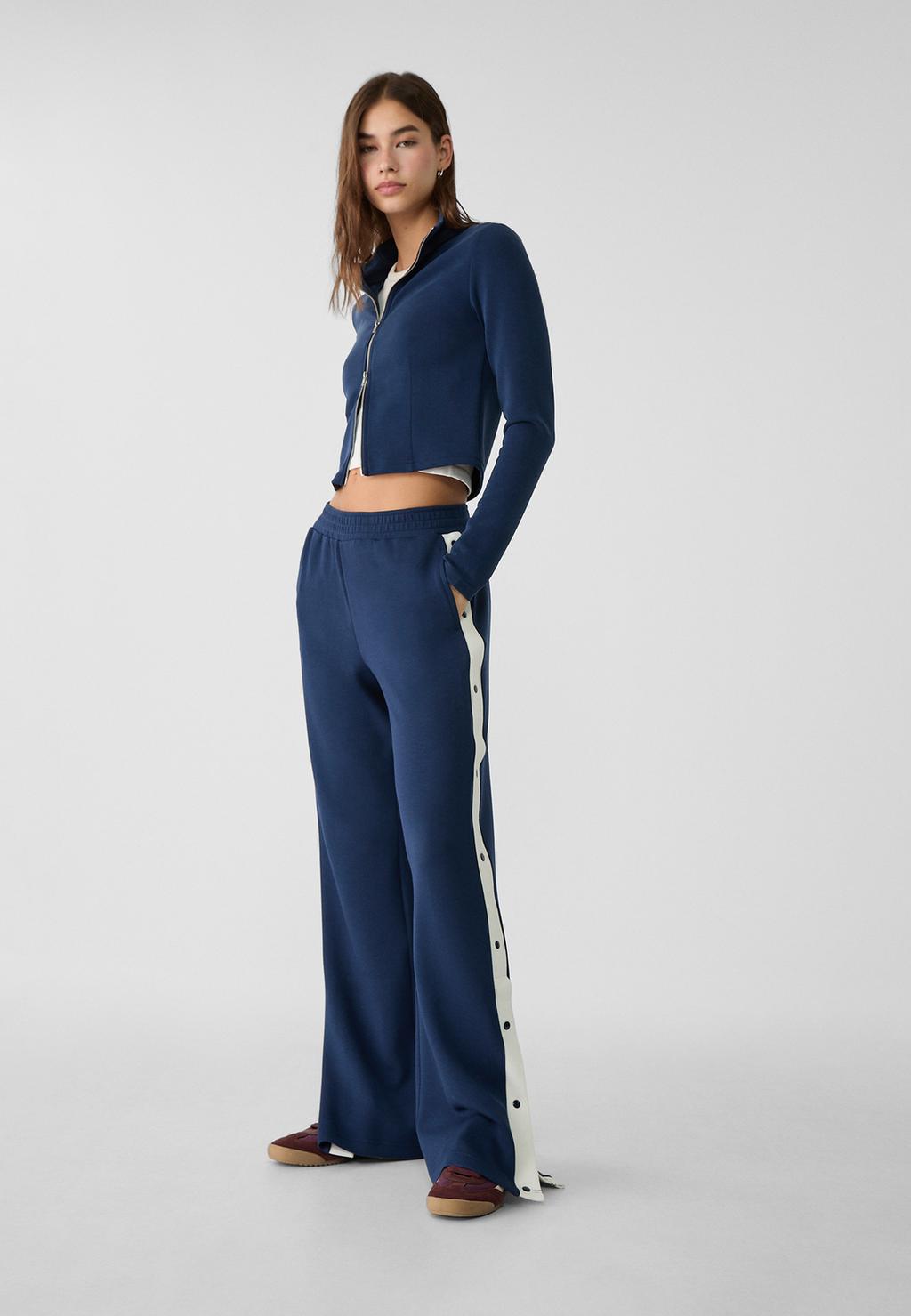 Soft trousers with side buttons