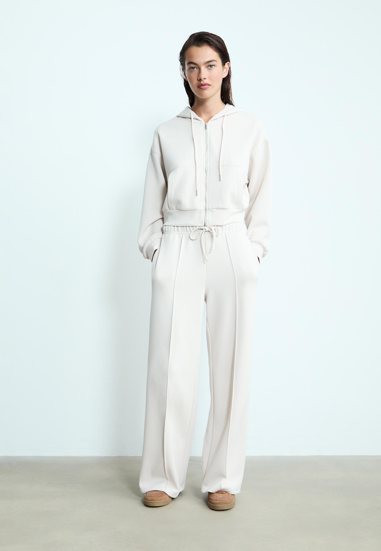 Soft-touch wide-leg pin-tuck joggers — Stone