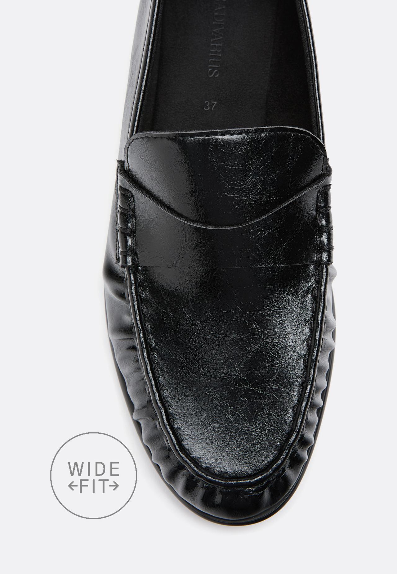 Wide-leg. Soft black leather effect loafers — BLACK