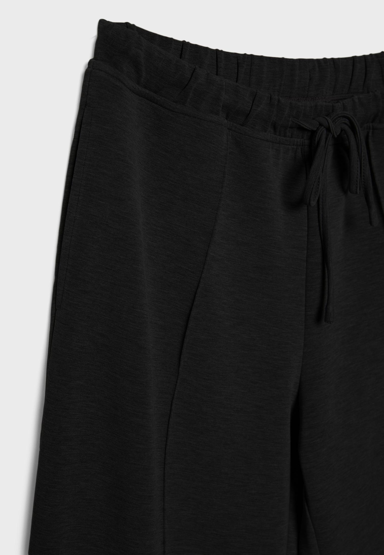 Soft-touch wide-leg pin-tuck joggers — Black