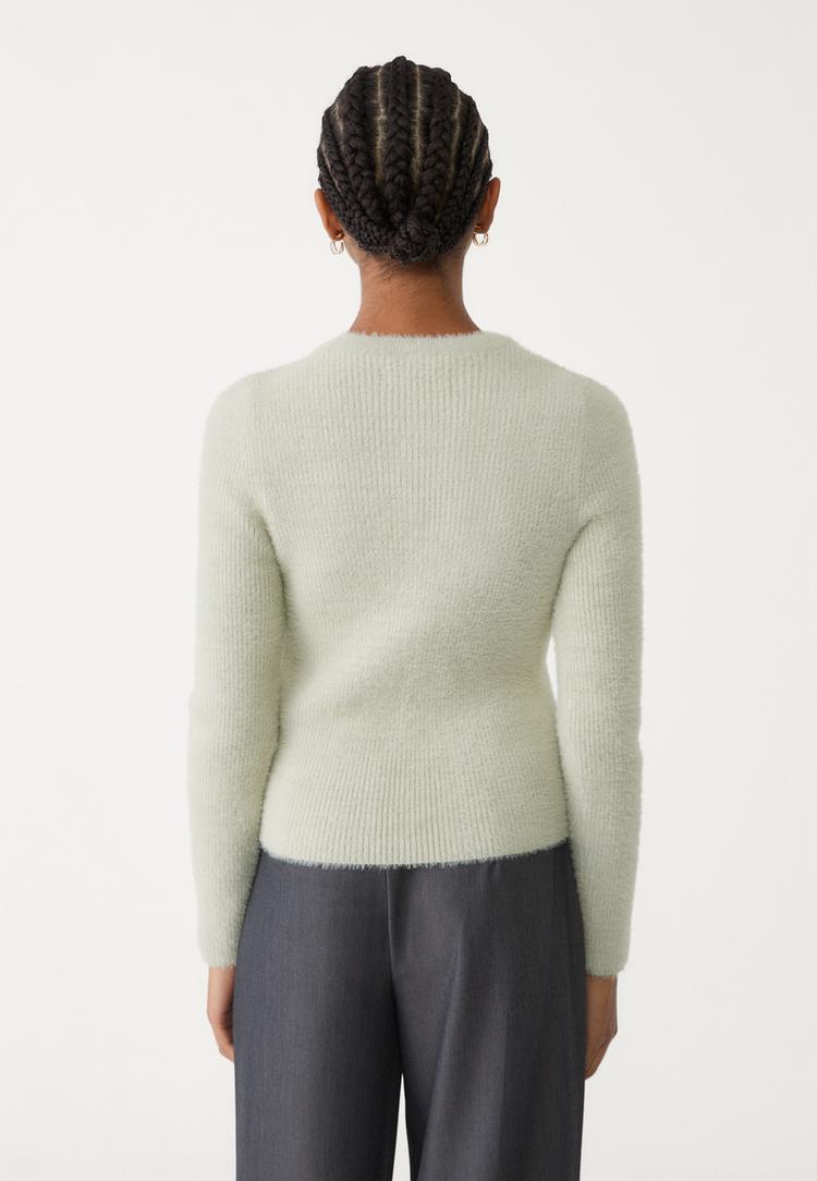 veste avec boutons en fausse fourrure
