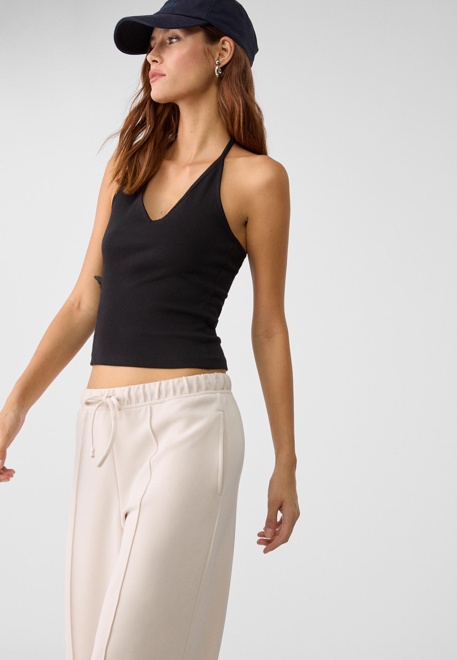 Soft-touch wide-leg pin-tuck joggers — Stone