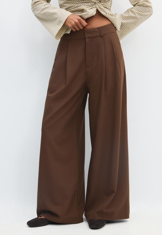 pantaloni eleganti wide leg con bottoni regolabili