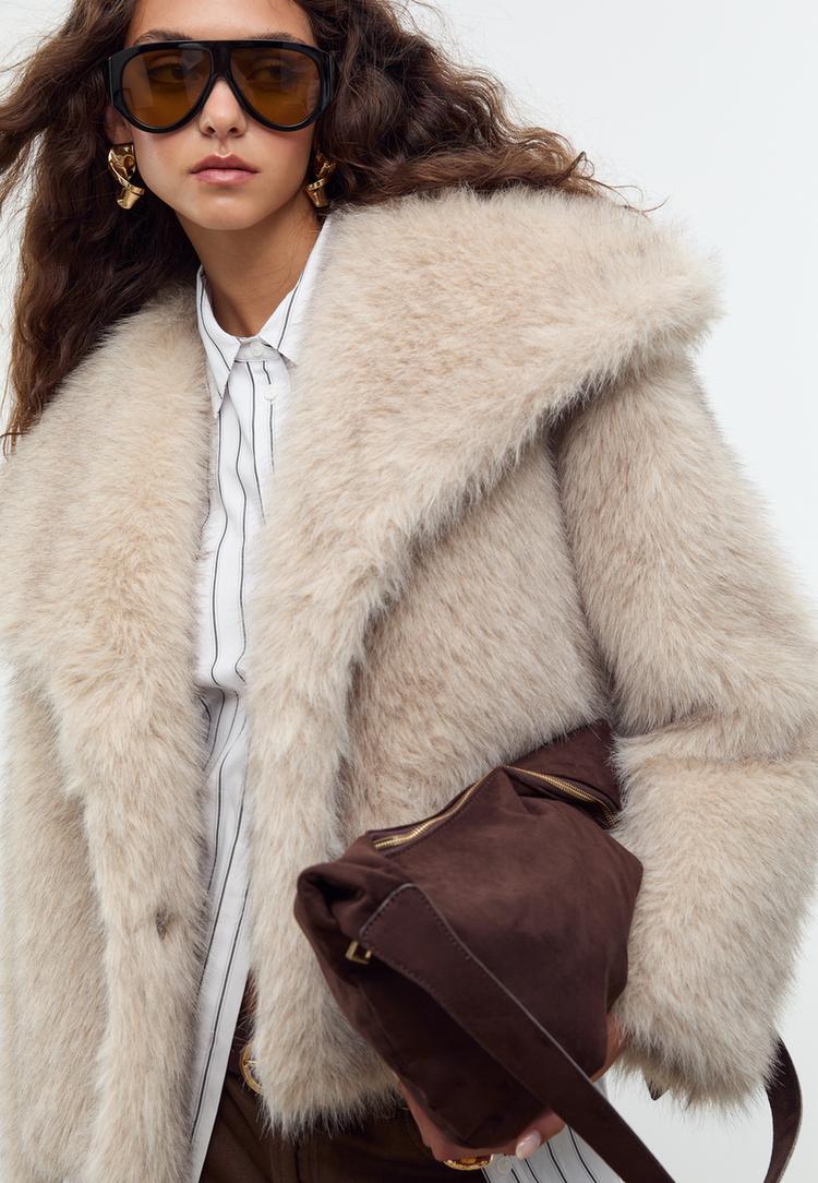 blouson court en fausse fourrure