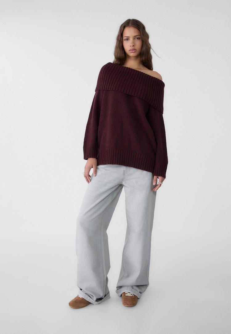 maglia in maglia con spalle scoperte