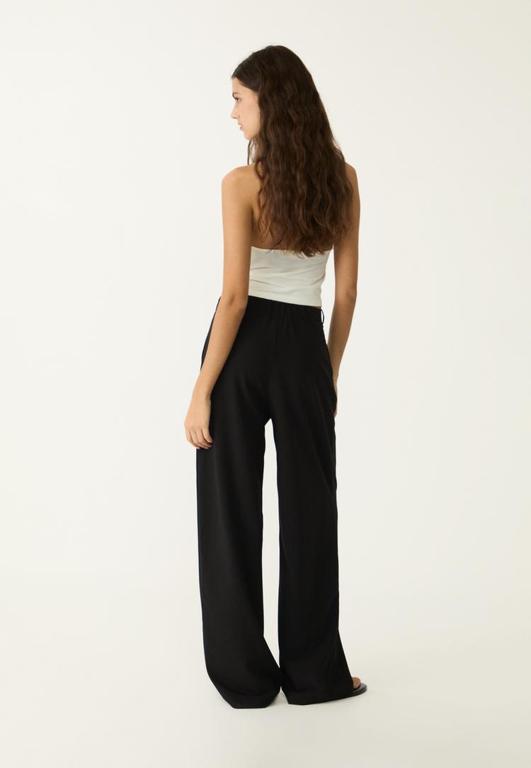 pantalon vestir ancho detalle hebilla