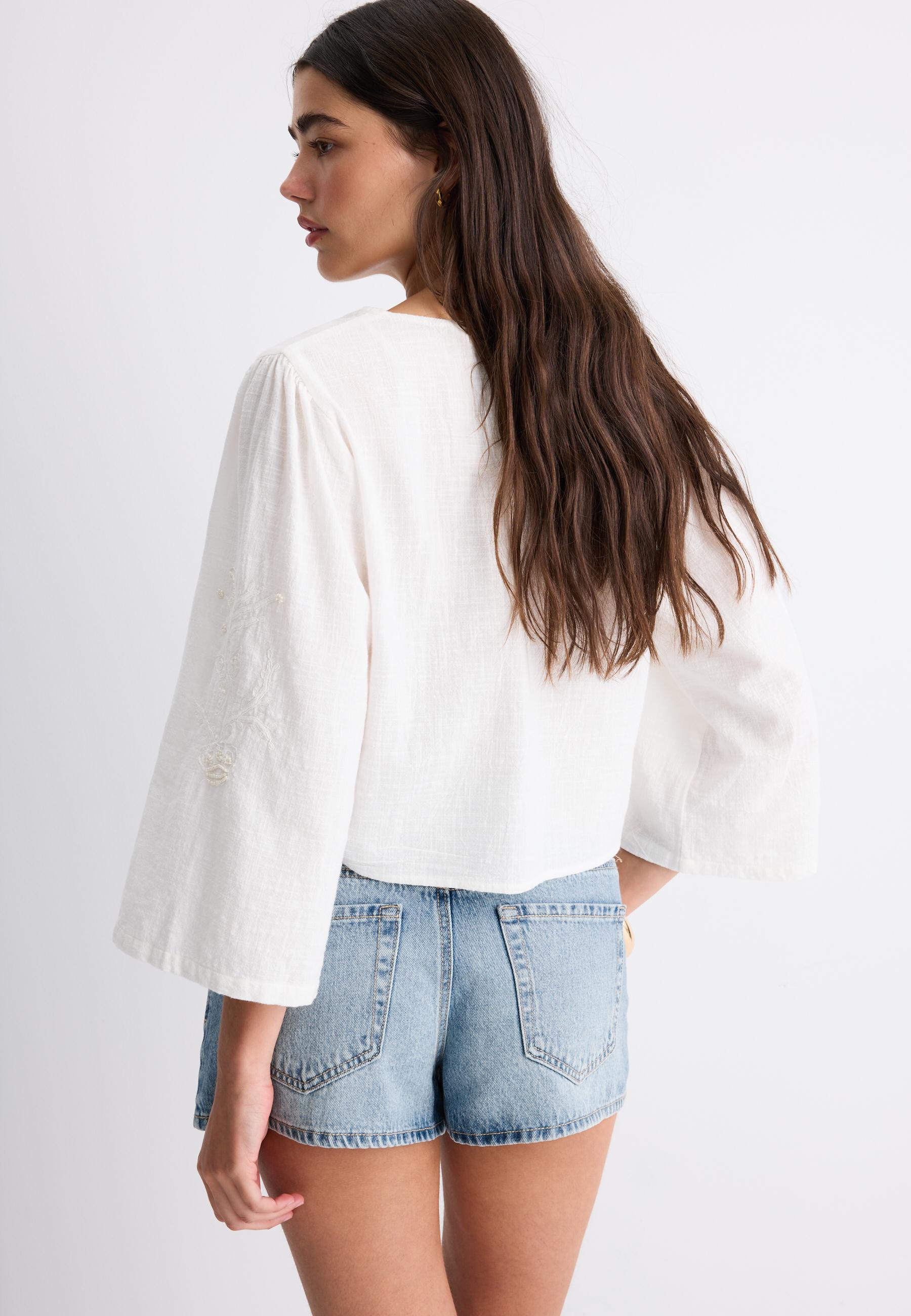 Embroidered faux pearl knot shirt — White